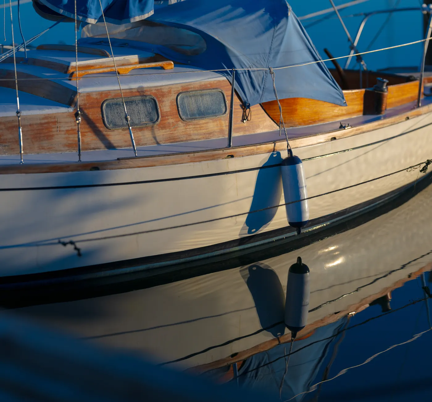 Varnished brightwork and joinery detail on a classic wooden sailboat