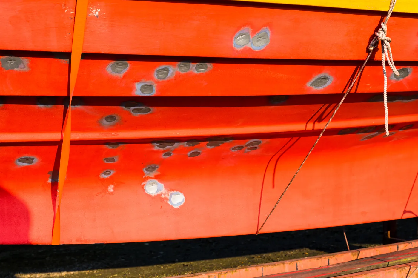 Osmotic blistering treated below the waterline on a fiberglass sailboat hull
